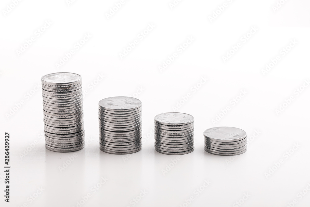 Stack of indian currency in coins arranged as a graph on white background Stack of indian currency in coins arranged as a graph on white background