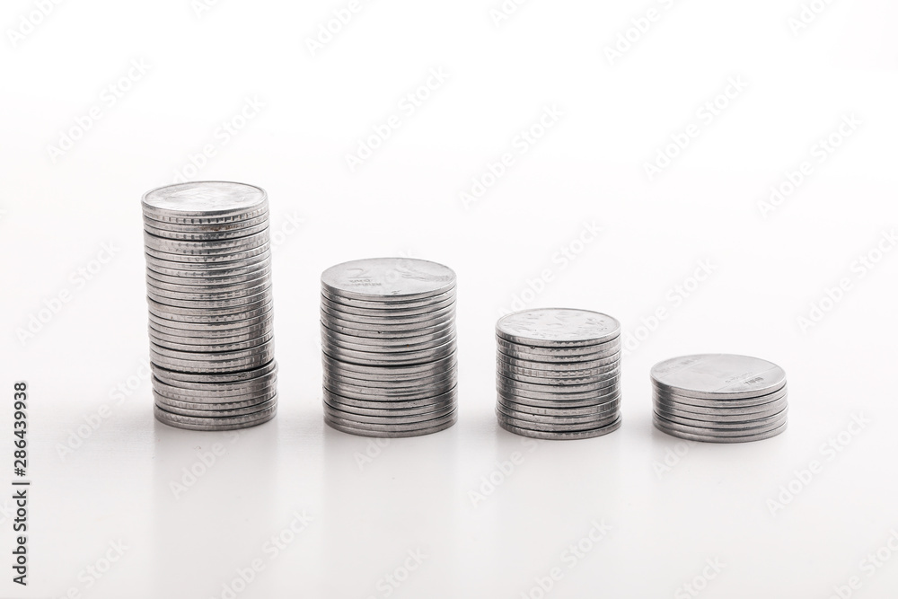 Stack of indian currency in coins arranged as a graph on white background Stack of indian currency in coins arranged as a graph on white background