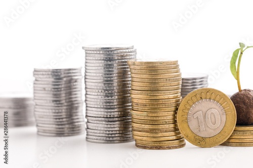 Stack of indian currency in coins  arranged as a graph on white background
