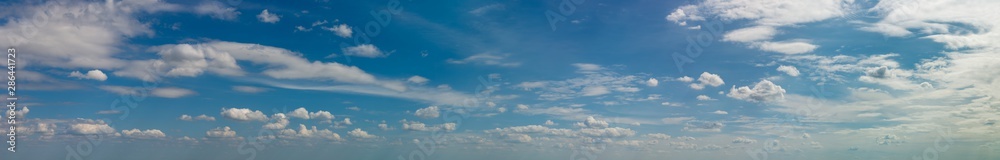 Fototapeta premium Fantastic soft clouds against blue sky, natural composition - panorama