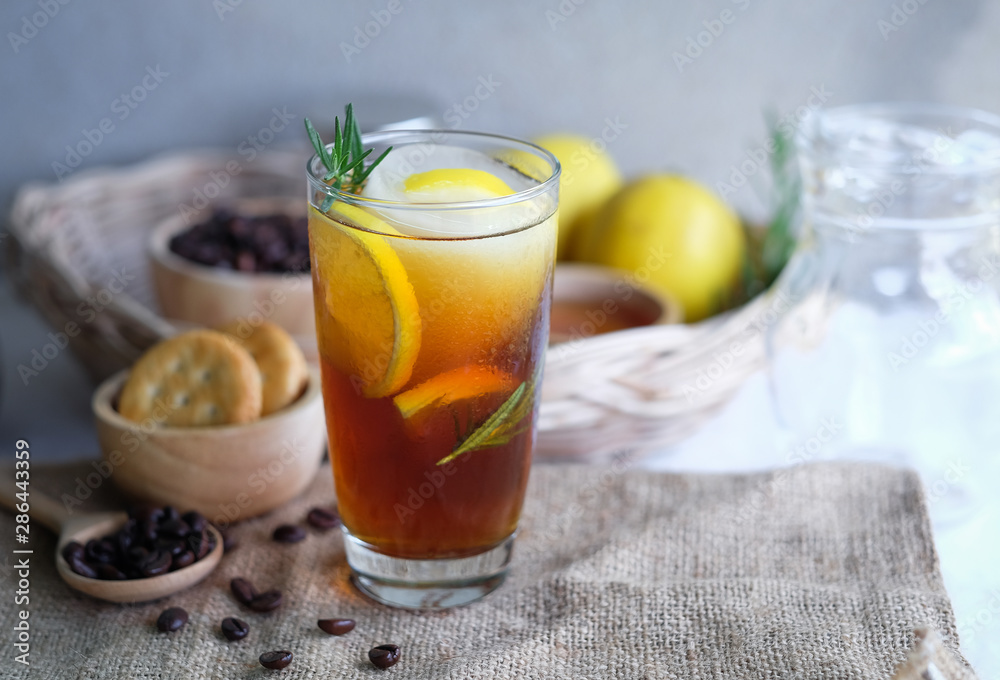 Americano iced coffee with lemon and rosemary for healthy drinking Americano iced coffee with lemon and rosemary for healthy drinking