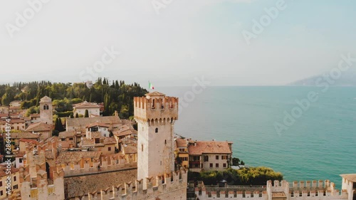 Wallpaper Mural Aerial sirmione castle on garda lake picturesque sunset summer evening veneto italy august 2019 with italian flag on top Torontodigital.ca