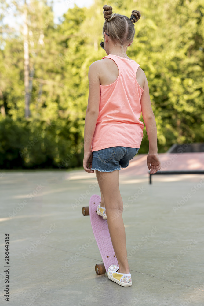 Back view of girl on skateboard Back view of girl on skateboard