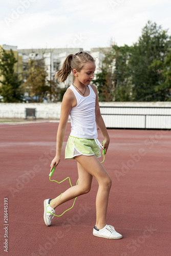 Side view of girl with jumprope