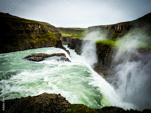 Gullfoss waterfall with dark clouds in Iceland