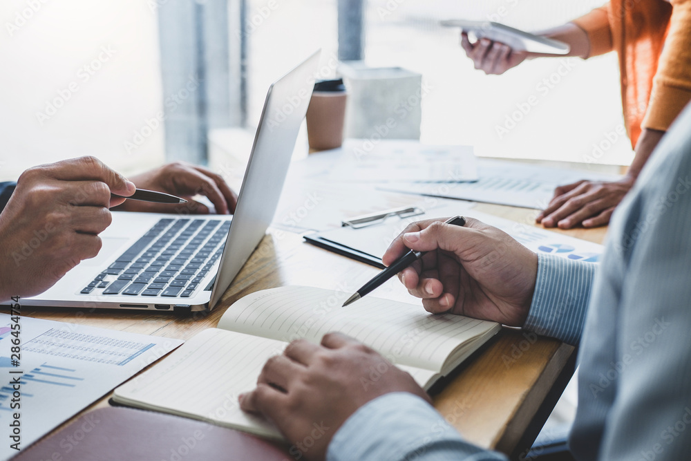 © Freedomz - Business team collaboration discussing working analyzing with financial data and marketing growth report graph in team, presentation and brainstorming to strategy planning making profit of company