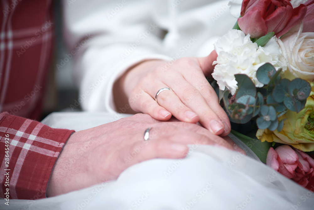 Loving couple holding hands with rings. happy wedding day Loving couple holding hands with rings. happy wedding day
