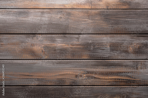 Rustic gray and orange wood background with knots and nail holes