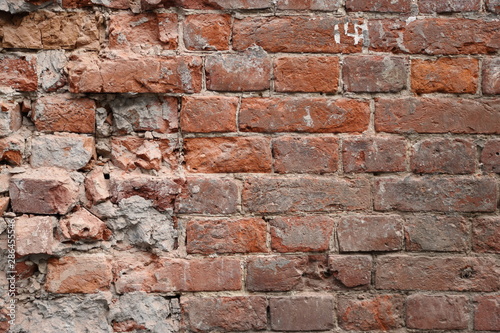 Old broken brick wall background