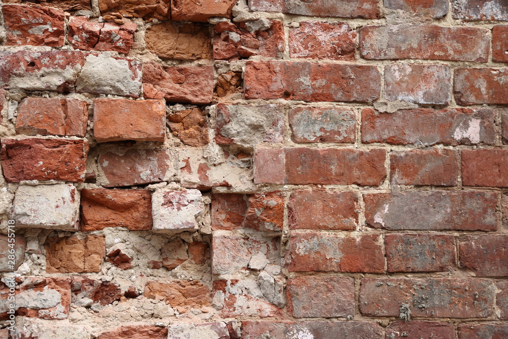 Old broken brick wall background Old broken brick wall background