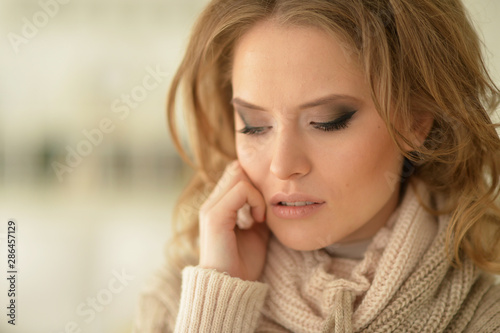 Close up view of sad young woman posing