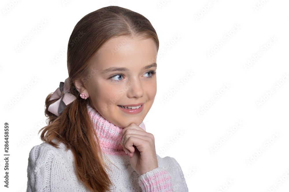 Portrait of smiling little girl wearing warm sweater