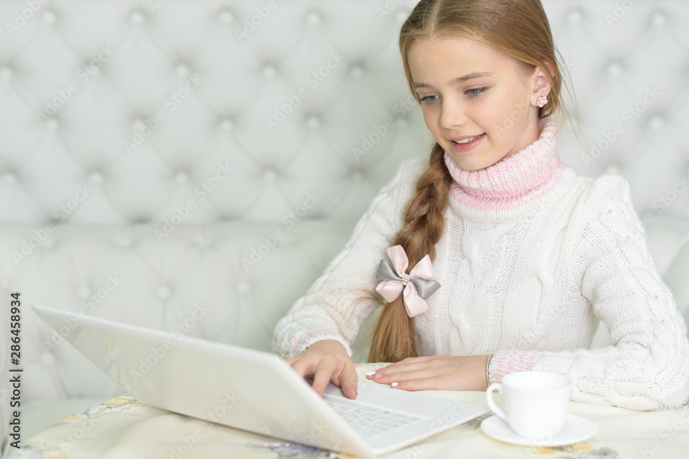 Portrait of cute beautiful girl using laptop Portrait of cute beautiful girl using laptop