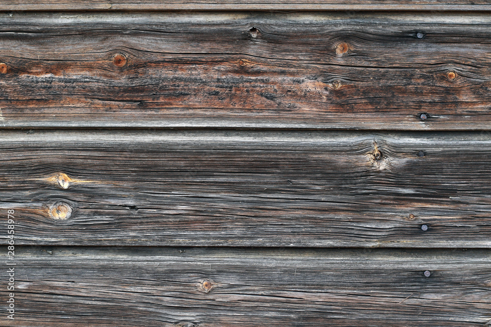Fototapeta premium old weathered brown plank wall background
