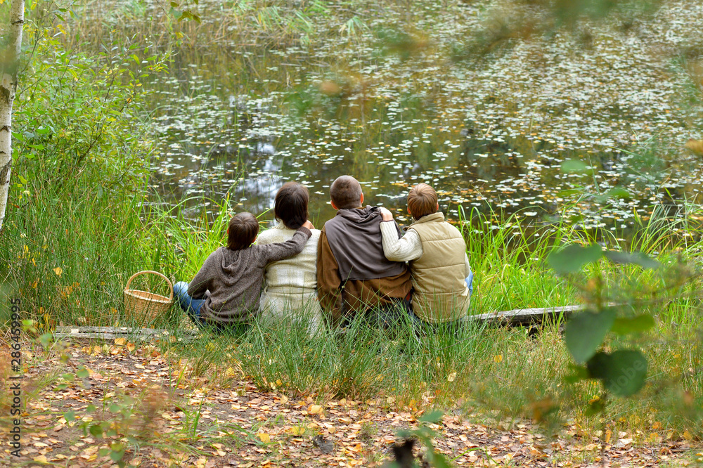 Portrait of family of four in park