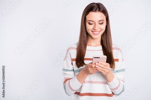 Photo of pretty lady with telephone in hands wear striped fluffy pullover isolated white background
