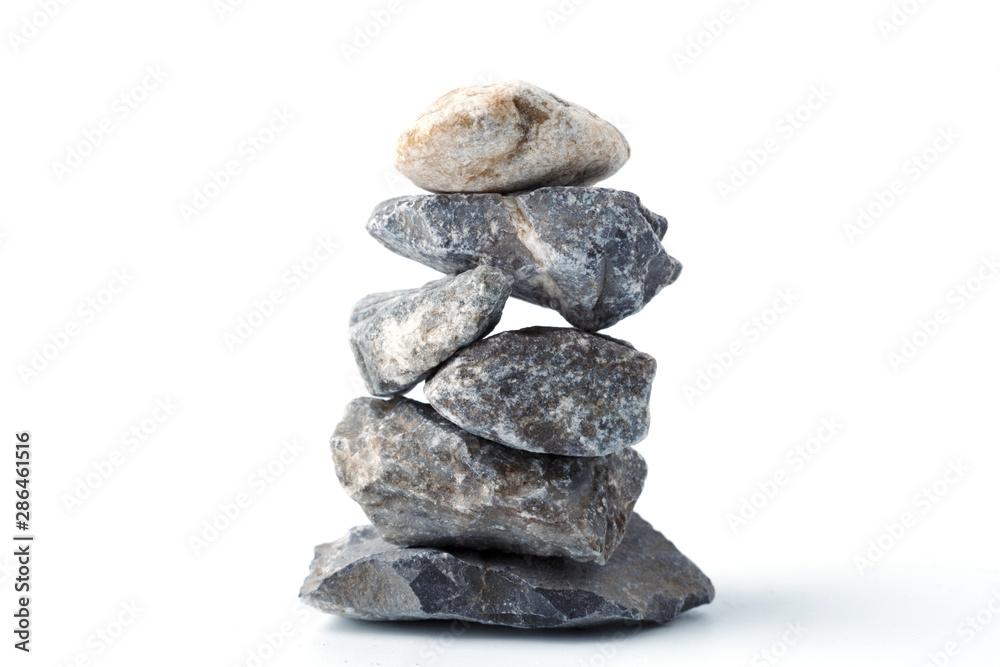 Pyramid of stones, isolated on white background. Zen Concept. Peaceful Concept.