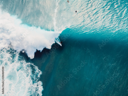 Obraz na plátně Aerial view of surfing at barrel waves