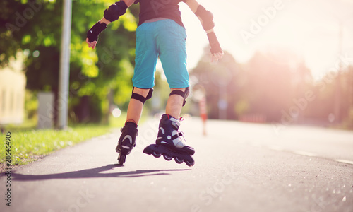 Obraz na płótnie child on roller Skates in the evening