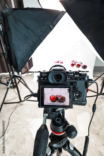 Closeup view of camera in home studio food photography.