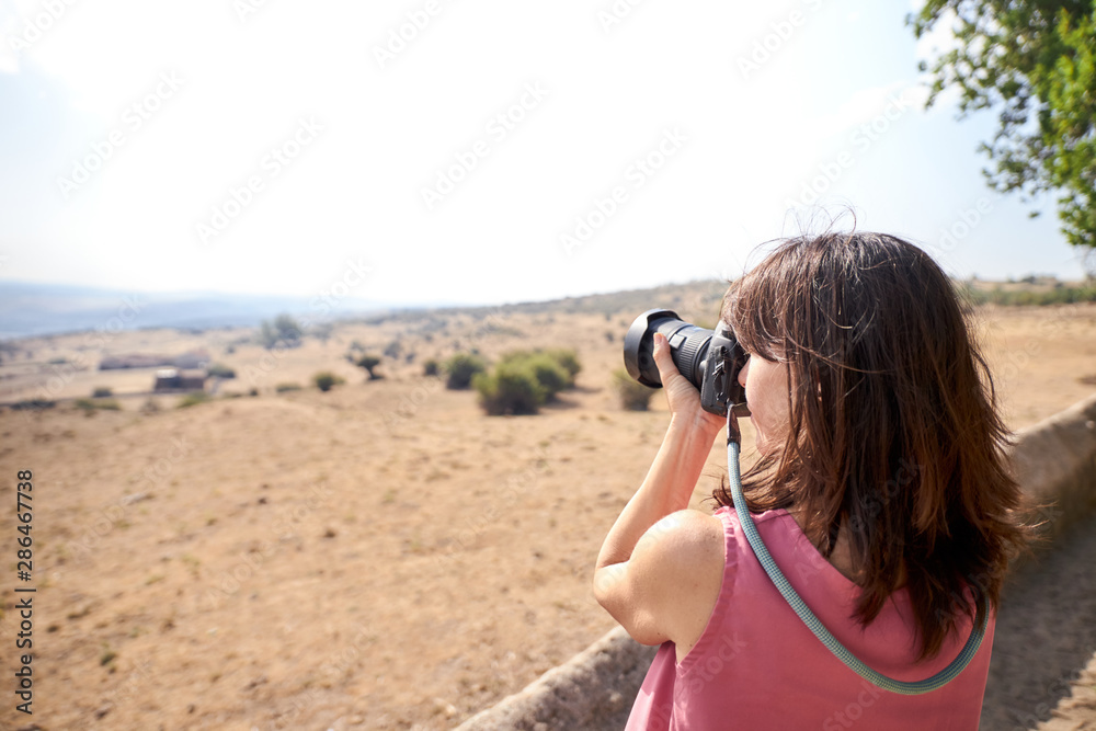 view of a woman photographing view of a woman photographing
