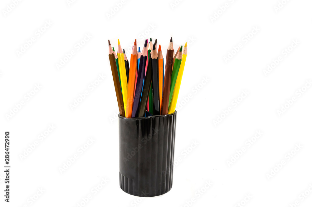 color pencils on a black stand isolated on a white background.