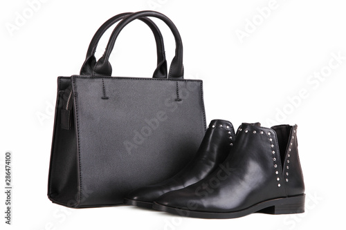 black handbag and black autumn boots