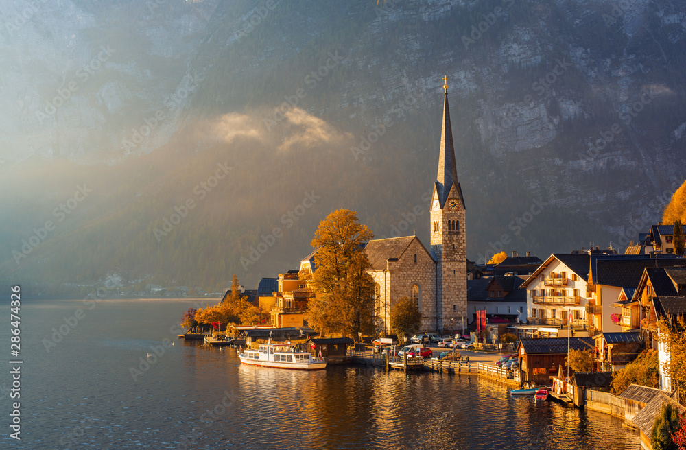 Autumn scenery of famous Hallstatt mountain village in the Alps , Upper Austria