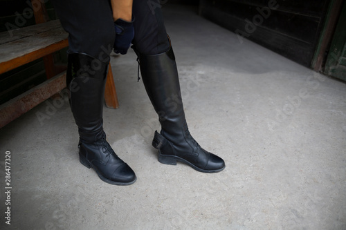 Equestrian sport. Leather equestrian boots. Riding clothes.