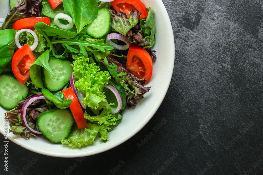 healthy salad (tomato, cucumber, mix leaves, onions and other ingredients) top menu concept. food background. copy space healthy salad (tomato, cucumber, mix leaves, onions and other ingredients) top menu concept. food background. copy space