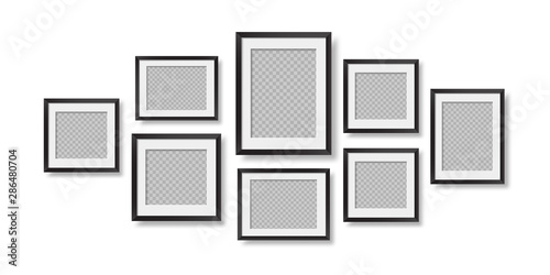 Composition of realistic black photo frames on the wall. Mockups for interior design.