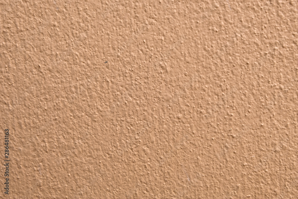 Brown cement wall background close up Brown cement wall background close up