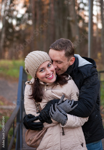  girl with guy in autumn park