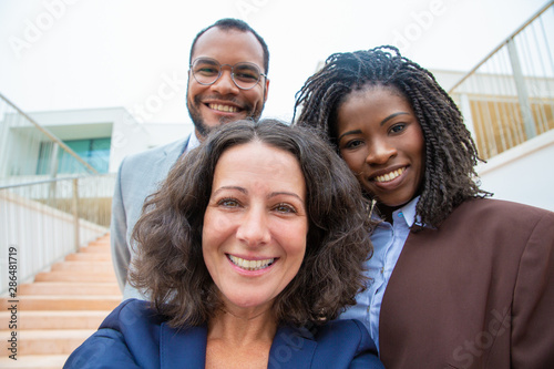 Happy multiethnic business people. Close-up portrait of cheerful multiracial business colleagues smiling at camera, Business team concept