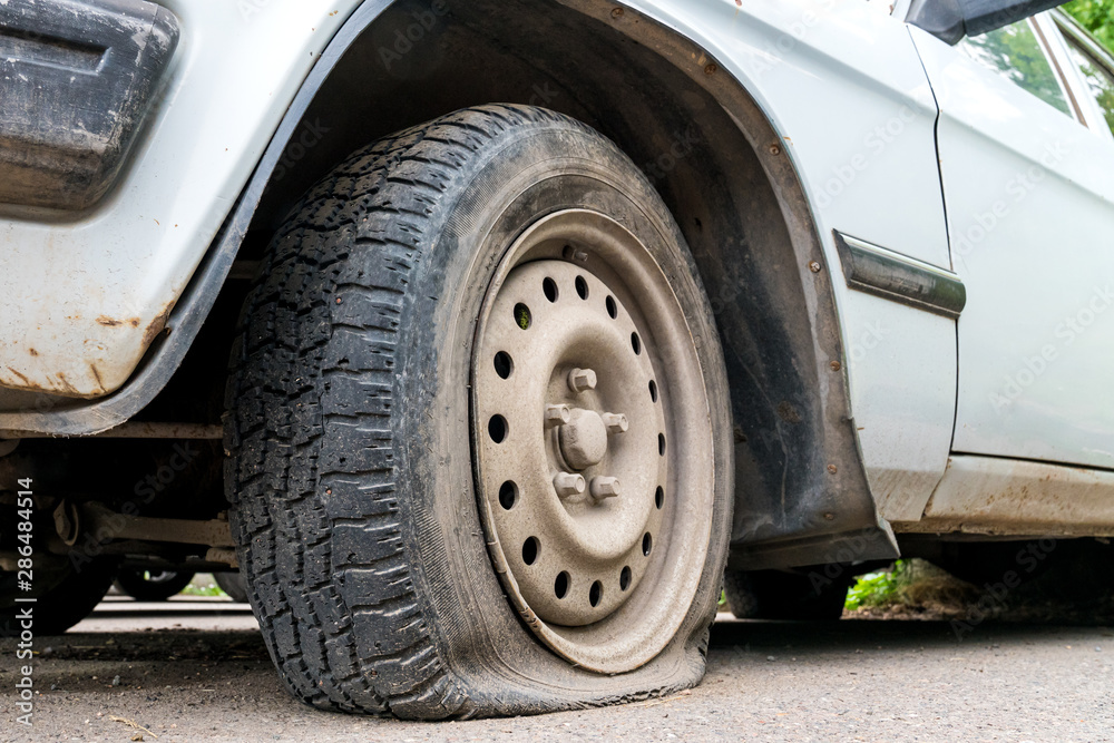 car wheel flat tire on the road car wheel flat tire on the road
