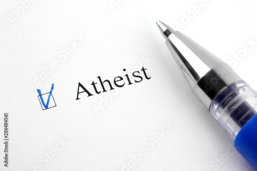 Atheist. Filling in the questionnaire, documents. The checkboxes are filled with a black pen on a white background. Questionnaire, survey.