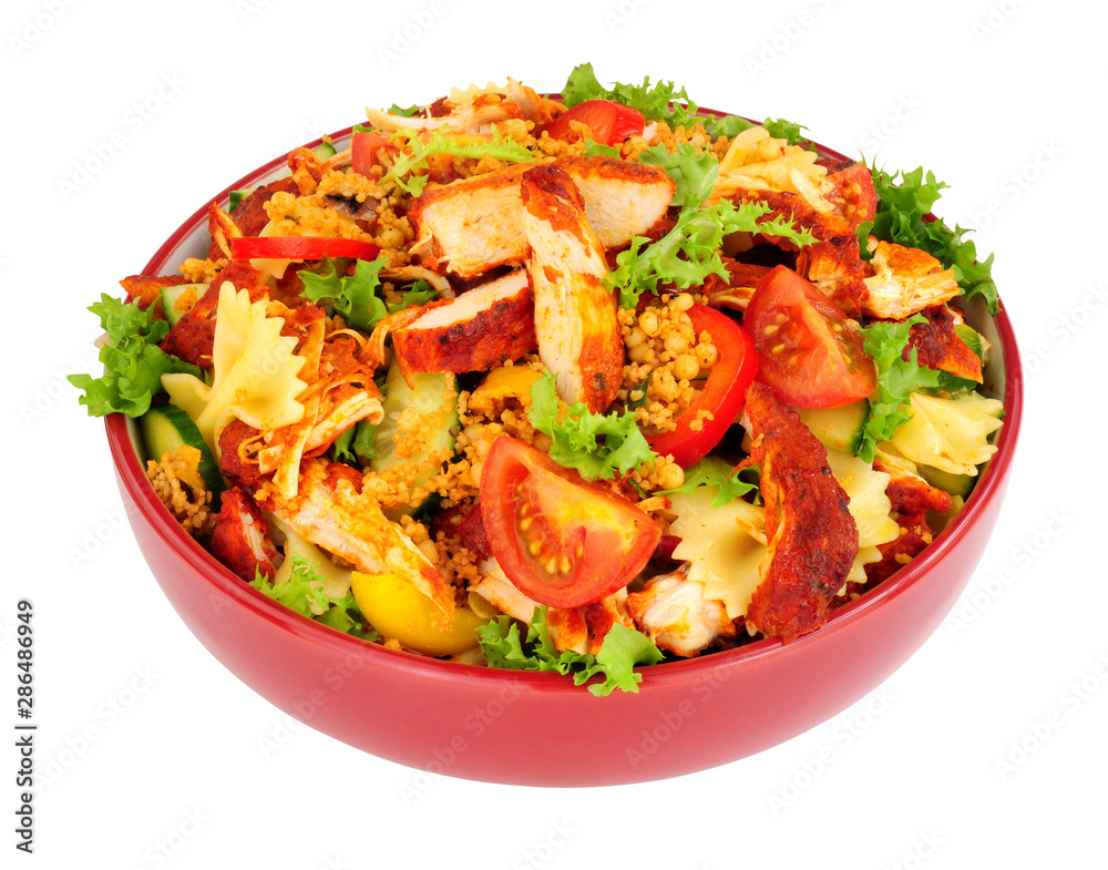 Chicken tikka and pasta salad bowl isolated on a white background Chicken tikka and pasta salad bowl isolated on a white background