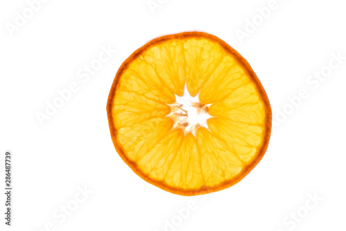 Macro photo of slices of juicy orange with back light isolated on white background. Top view