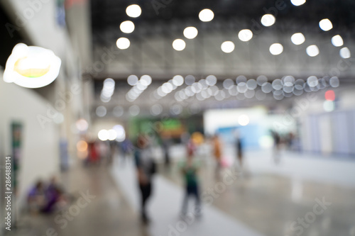 Wallpaper Mural Blurred images of trade fairs in the big hall. image of people walking on a trade fair exhibition or expo where business people show innovation activity and present product in a big hall. Torontodigital.ca