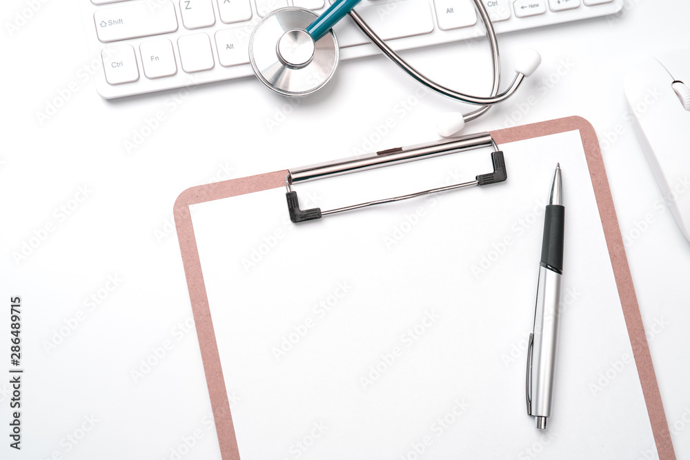 Doctor diagnoses concept - stethoscope on computer keyboard with medical record case and pen on white working table. Top view, flat lay, copy space Doctor diagnoses concept - stethoscope on computer keyboard with medical record case and pen on white working table. Top view, flat lay, copy space