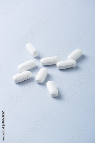 Lysine tablets. Concept for a healthy dietary supplementation. Nervous System Support. Bright background. Close up. Copy space. 