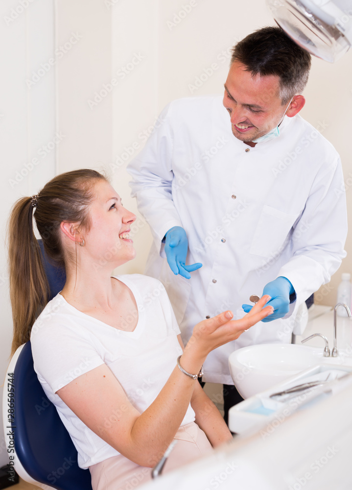 Fototapeta premium Female is consulting with stomatologist