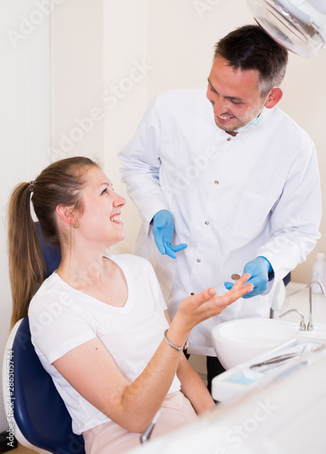 Female is consulting with stomatologist