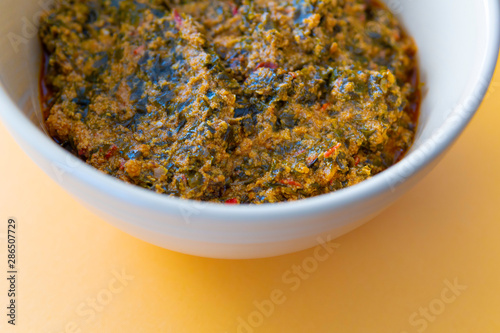 A bowl of Nigerian Spicy Egusi Soup Ready to eat photo