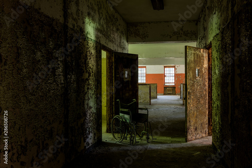 Derelict Hallway + Wheelchair - Abandoned Creedmoor State Hospital - Queens, New York City, New York photo