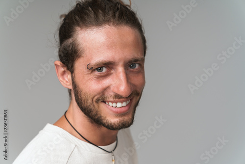 Handsome young bearded guy wearing casual clothing isolated