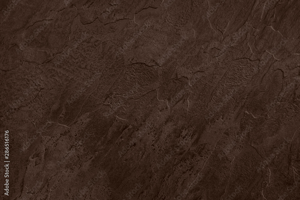 Fototapeta premium Close up of abstract dark brown stone texture with high resolution.