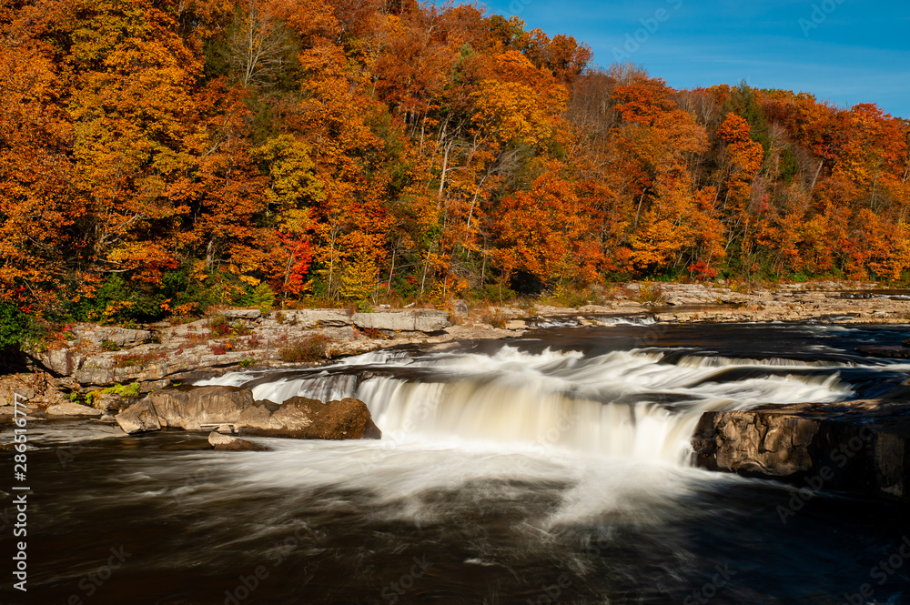 Ohiopyle Falls - Long Exposure Waterfall in Waterfall in Peak Autumn / Fall Season - Ohiopyle State Park, Pennsylvania Ohiopyle Falls - Long Exposure Waterfall in Waterfall in Peak Autumn / Fall Season - Ohiopyle State Park, Pennsylvania