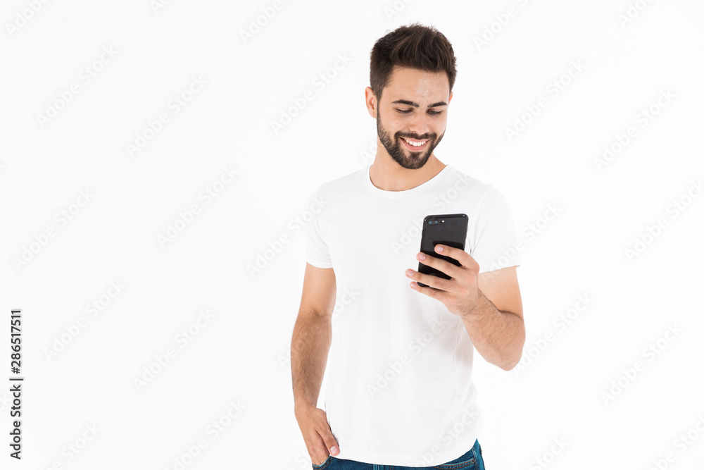 Smiling young brunette bearded man wearing casual outfit Smiling young brunette bearded man wearing casual outfit