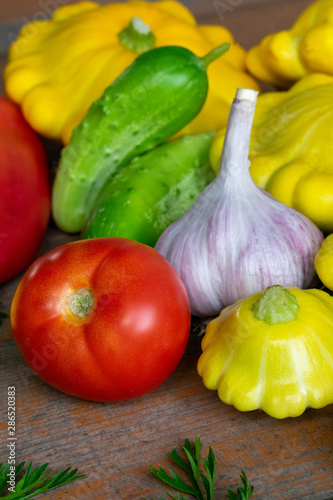 Vegetables on a wooden background close-up. Autumn rich harvest. Rural still life.
